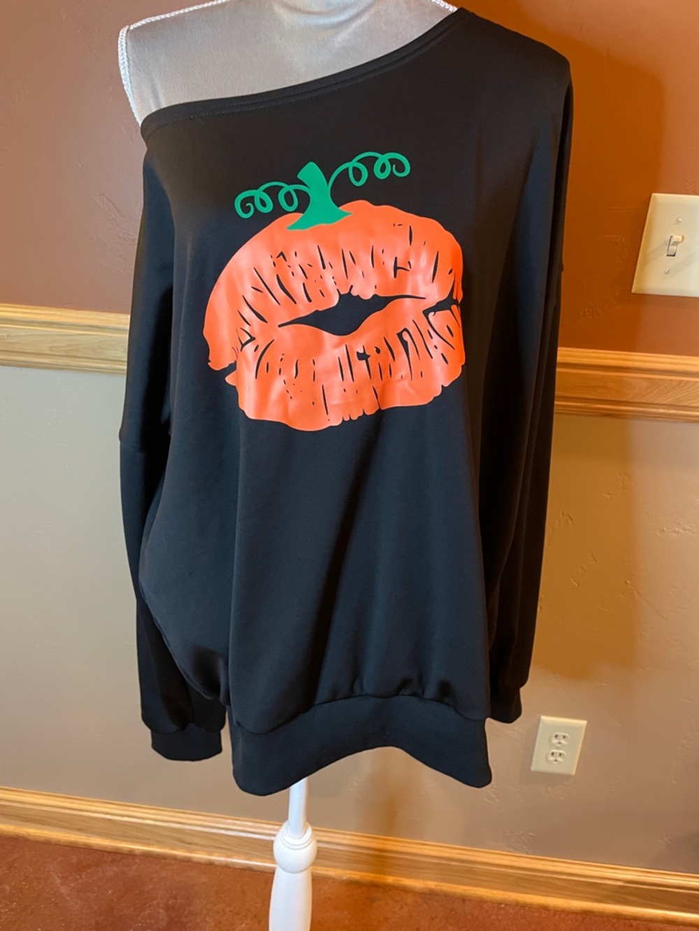 Off-Shoulder Black Sweatshirt with Pumpkin Lip Graphic